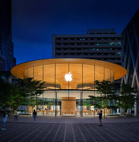  Exterior of an Apple Store location at night.