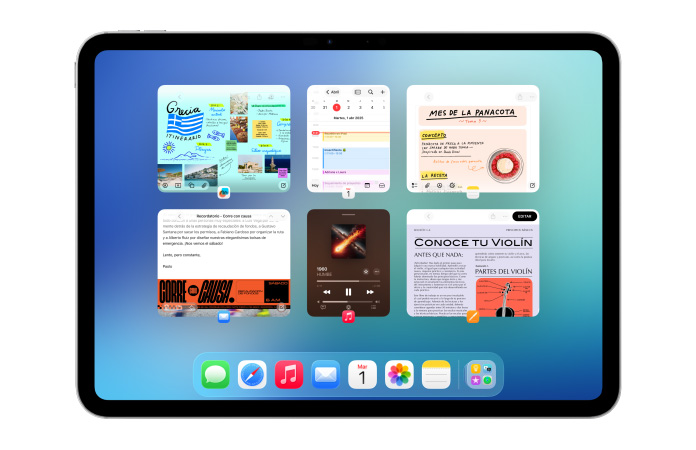 Un iPad, posición horizontal, la pantalla muestra varias apps como Calendario y Música acomodadas en un mosaico de seis ventanas dispuestas en dos filas de igual tamaño