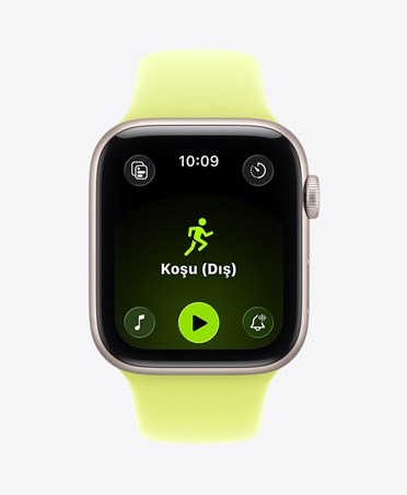 Apple Watch SE 3, alüminyum kasa, yıldız ışığı renk, Koşu (Dış) antrenmanı açık, ekranın alt kısmında Apple Music oynatma kontrolleri, Spor Kordon, neon sarı renk
