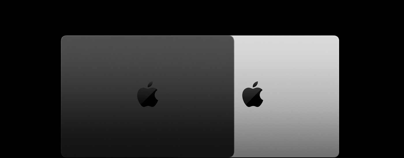 俯視兩部闔上的 Mac 筆電，以部分疊放的方式並列。